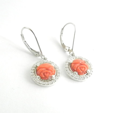 Custom design leverback earrings with coral carved into delicate rose buds surrounded by moissanite.