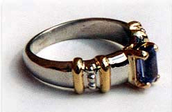 Emerald Cut Tanzanite Set in a Two Tone Band