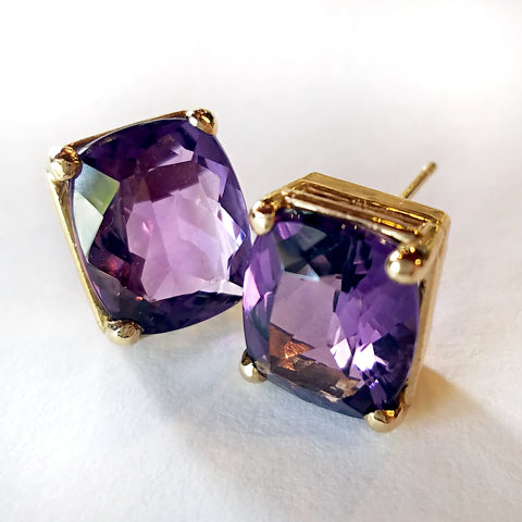 Breathe new life into your unique style with custom made gold stud earrings set with cushion cut amethyst.