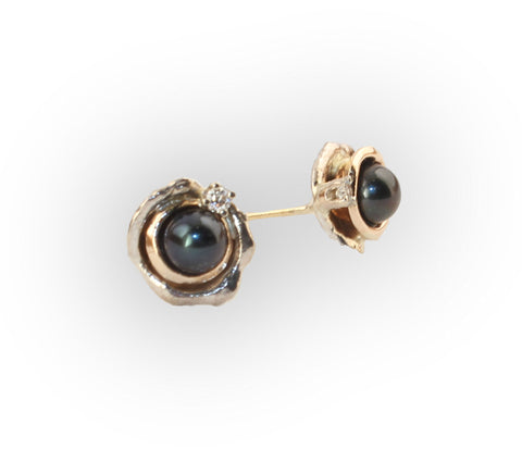 Silver and gold stud earrings with Tahitian pearls like a night sky with twinkling diamonds.