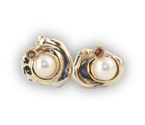 Custom design Akoya pearl earrings with cognac diamonds nestles in 14K gold 'puddles'