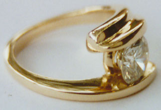 Diamond Solitaire bezel set in a Bypass Setting