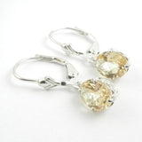 Oval citrines on silver leverback earrings with silver filigree details.