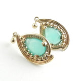 Custom design gold earrings for women feature pear shaped peruvian opal earrings set in 14kt yellow gold.
