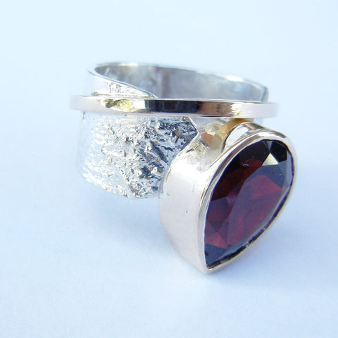 Pear Garnet Set in a Reticulated Silver Band