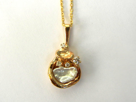 Fancy Pearl in 14K Gold with Diamond accents.