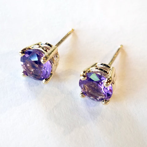 Add an elegant touch with these custom design gold stud earrings set with round amethyst stones.