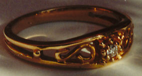 Gold Filigree band with a Diamond Center
